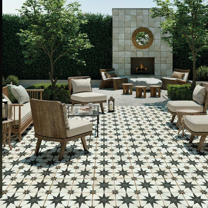 Peronda FS Rockstar ceramic garden tile flooring with garden sofas, and outdoor fireplace.