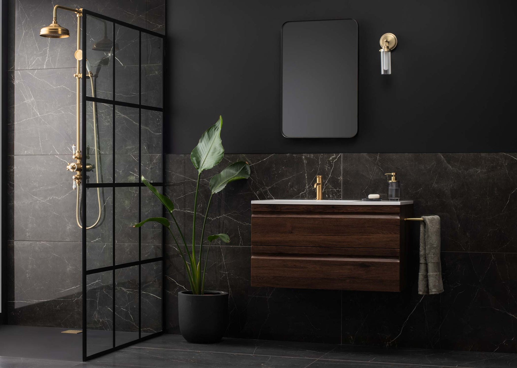 Marmi nero tile used as a wall and floor tile in a bathroom and shower