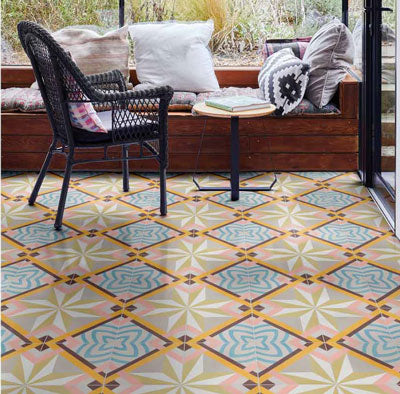 porcelain floor tile with printed pattern in front of chair and window