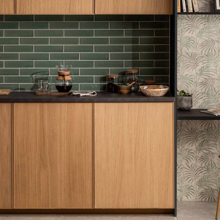 green kitchen tile with wooden cupboards and work space