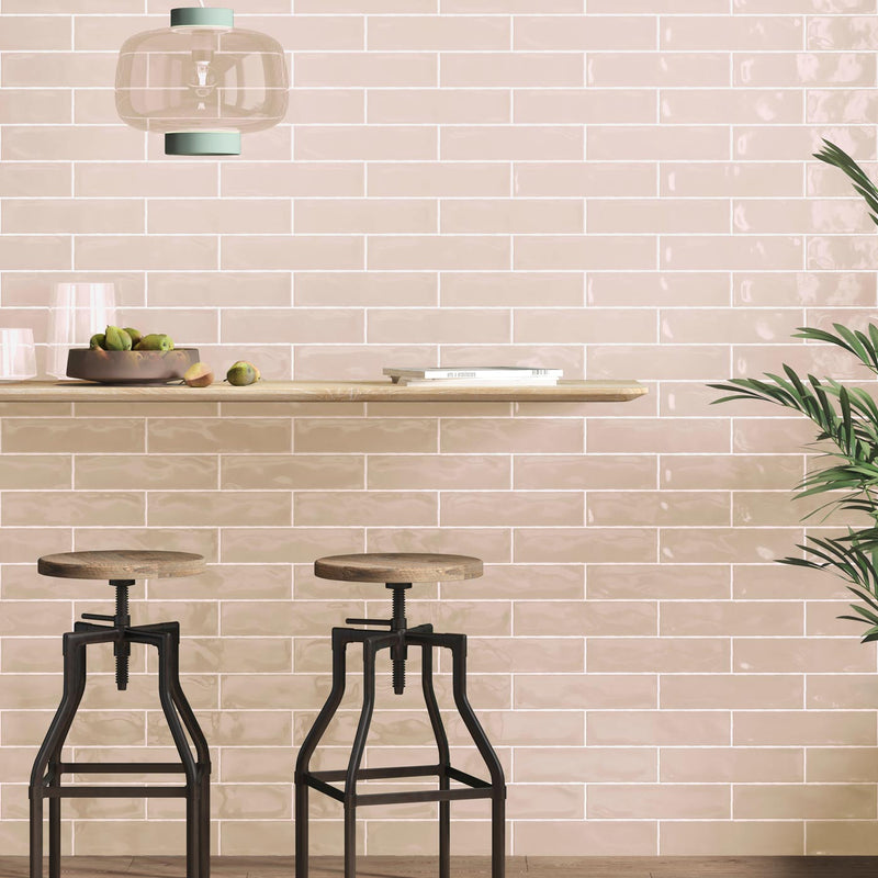 Image of Pink brick wall tiles with a breakfast bar and stools