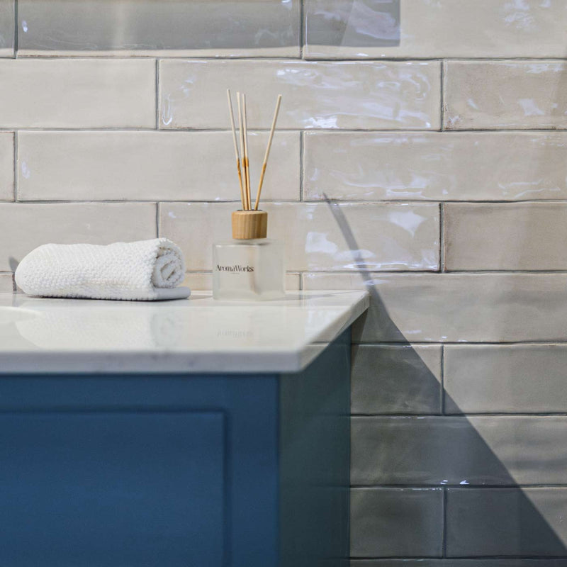 Image of bathroom sink with white brick tiles