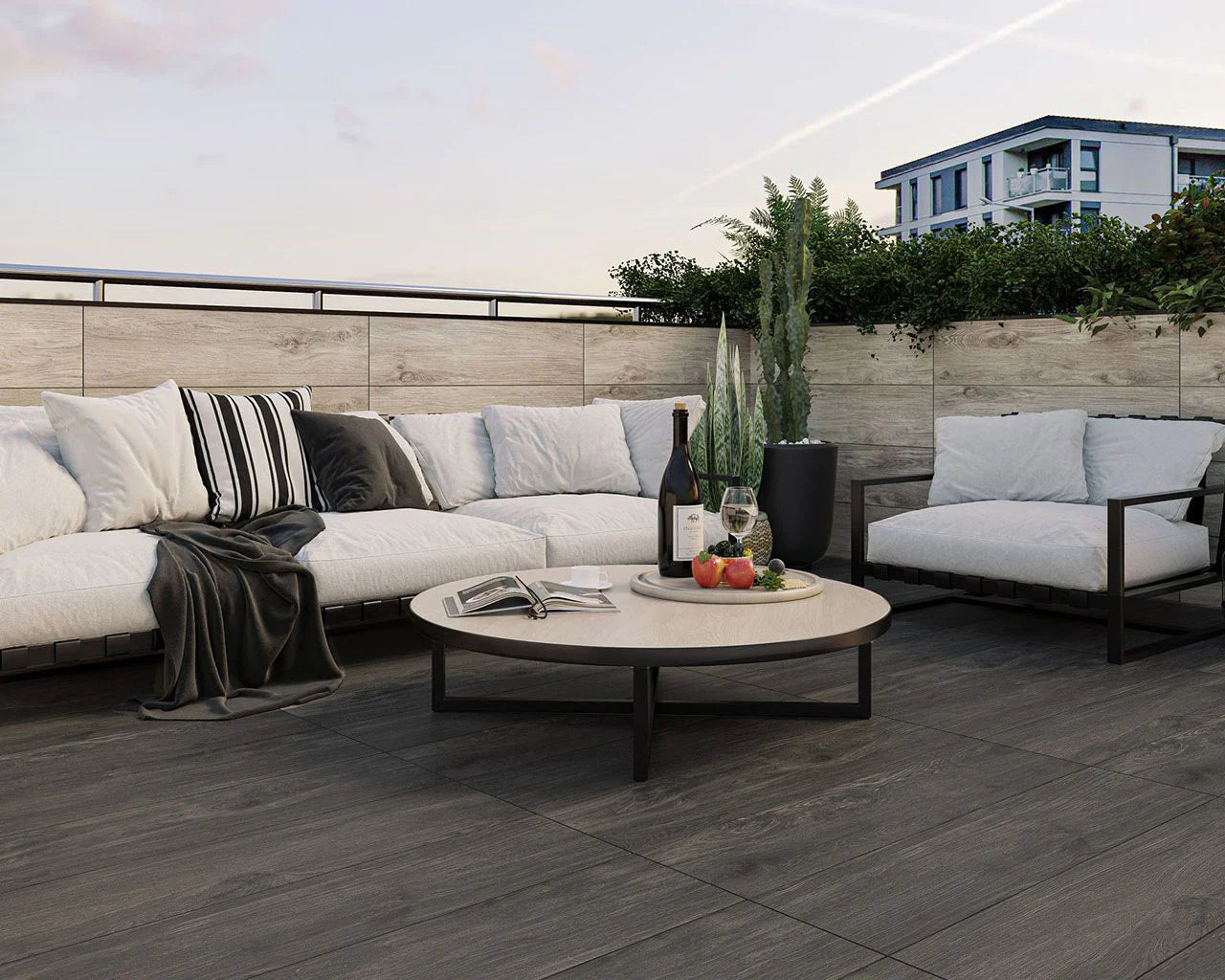 Image of porcelain paving laid with pedestals for paving. Wood effect slabs with outdoor sofa and coffee table
