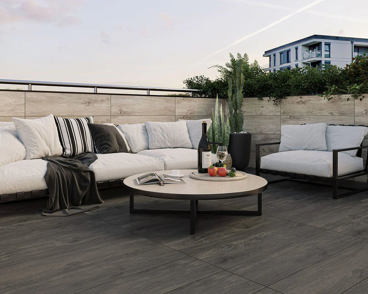 porcelain paving laid with pedestals for paving. Wood effect slabs with outdoor sofa and coffee table