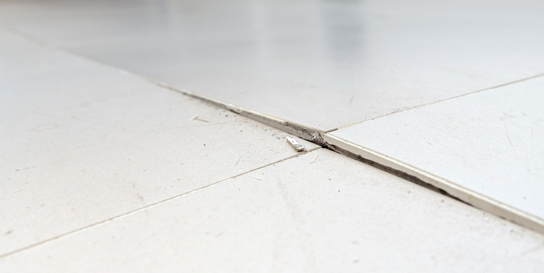 cracked floor tile due to sub floor movement