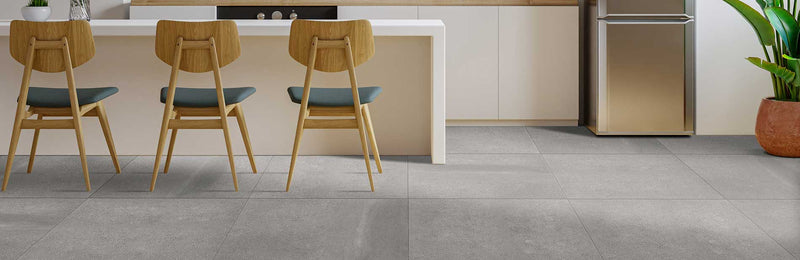 Image of kitchen breakfast bar with wooden chairs and large porcelain tiles 