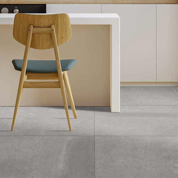 kitchen breakfast bar with wooden chairs and large porcelain tiles 