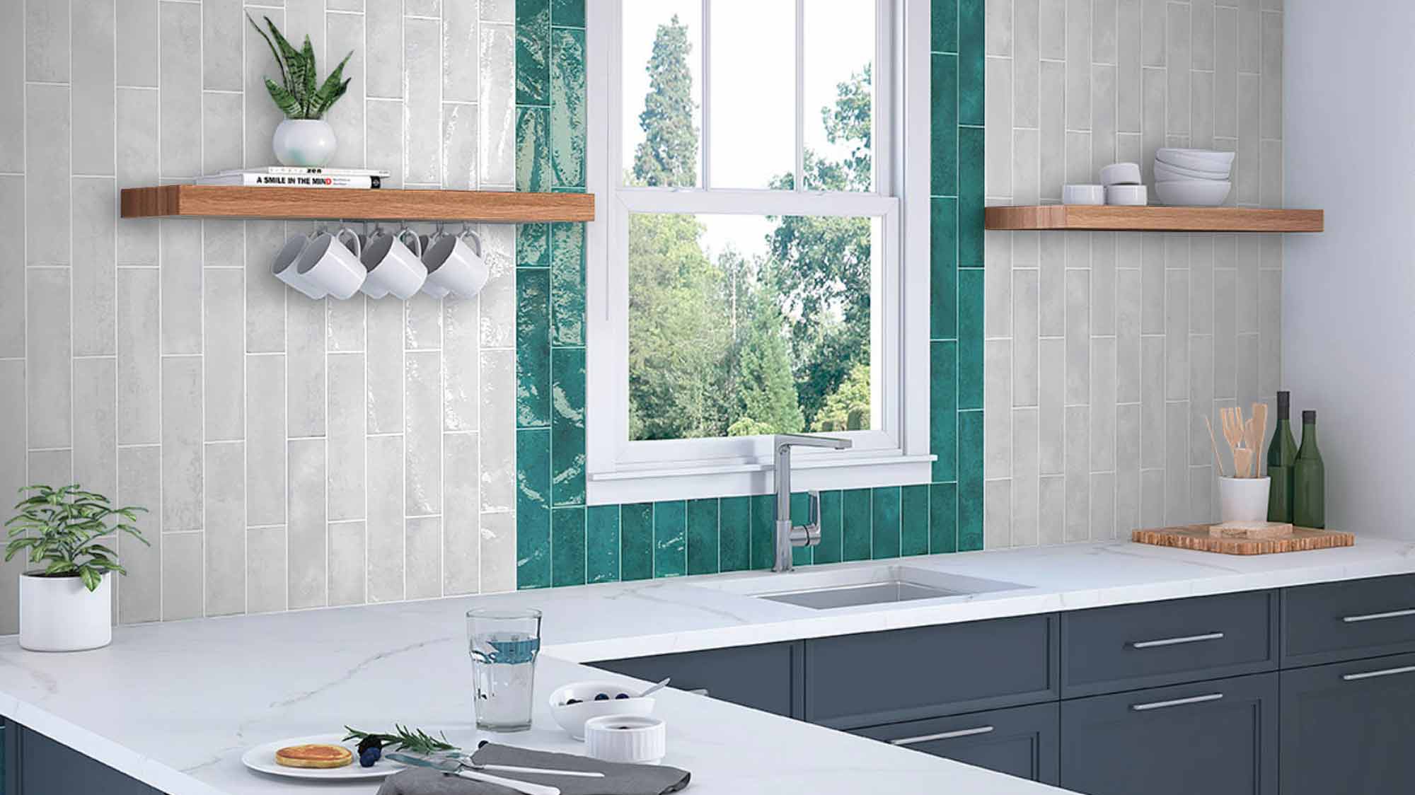 Image of kitchen work top with white and green tile splash back walls