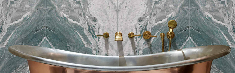 Image of Magnifique Ocean Bookmatched Porcelain Polished tile 60x120cm with a brass free standing bath