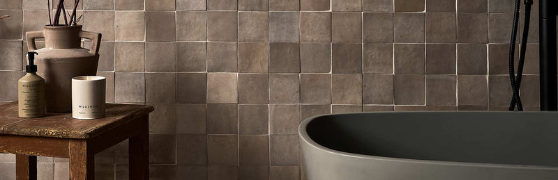 Image of grey bathroom wall tile with free standing bath and side table