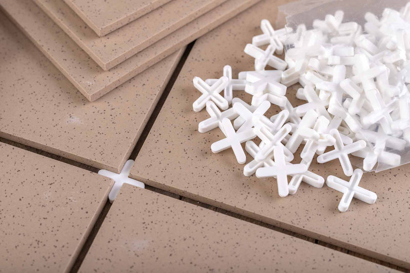 Image of pack of spacers on top of floor tiles