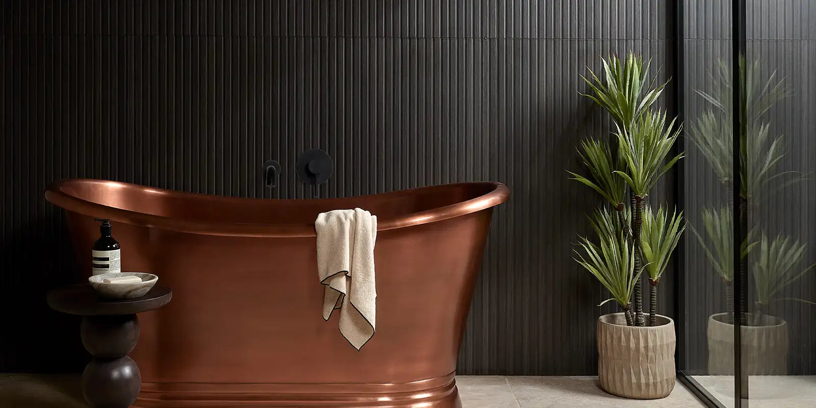 wood effect tile slat on a bathroom wall with free standing bath