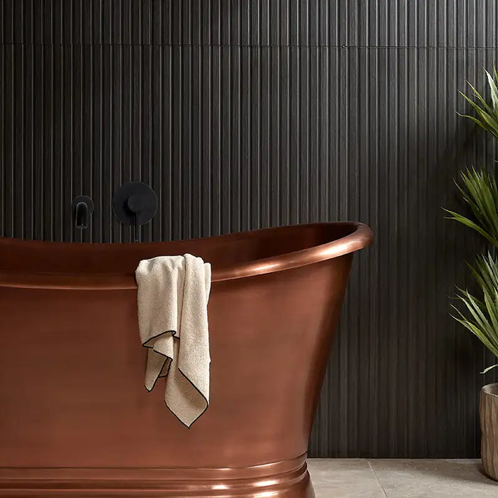 wood effect tile slat on a bathroom wall with free standing bath