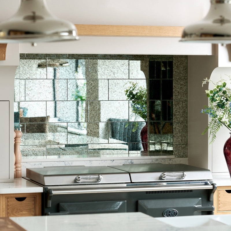 Image of Modern kitchen with a glass tiles backsplash and stainless steel appliances.