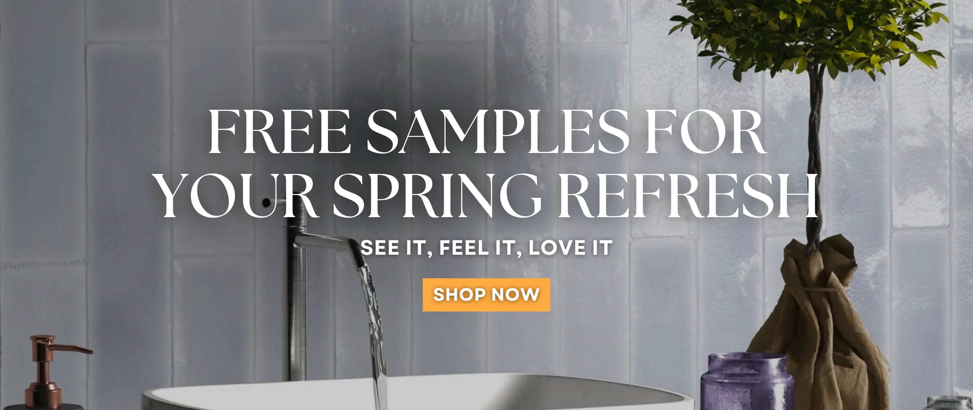 brick wall tile behind a basin and free standing basin tap with small house tree  to the side - free samples for your springe refresh - shop now