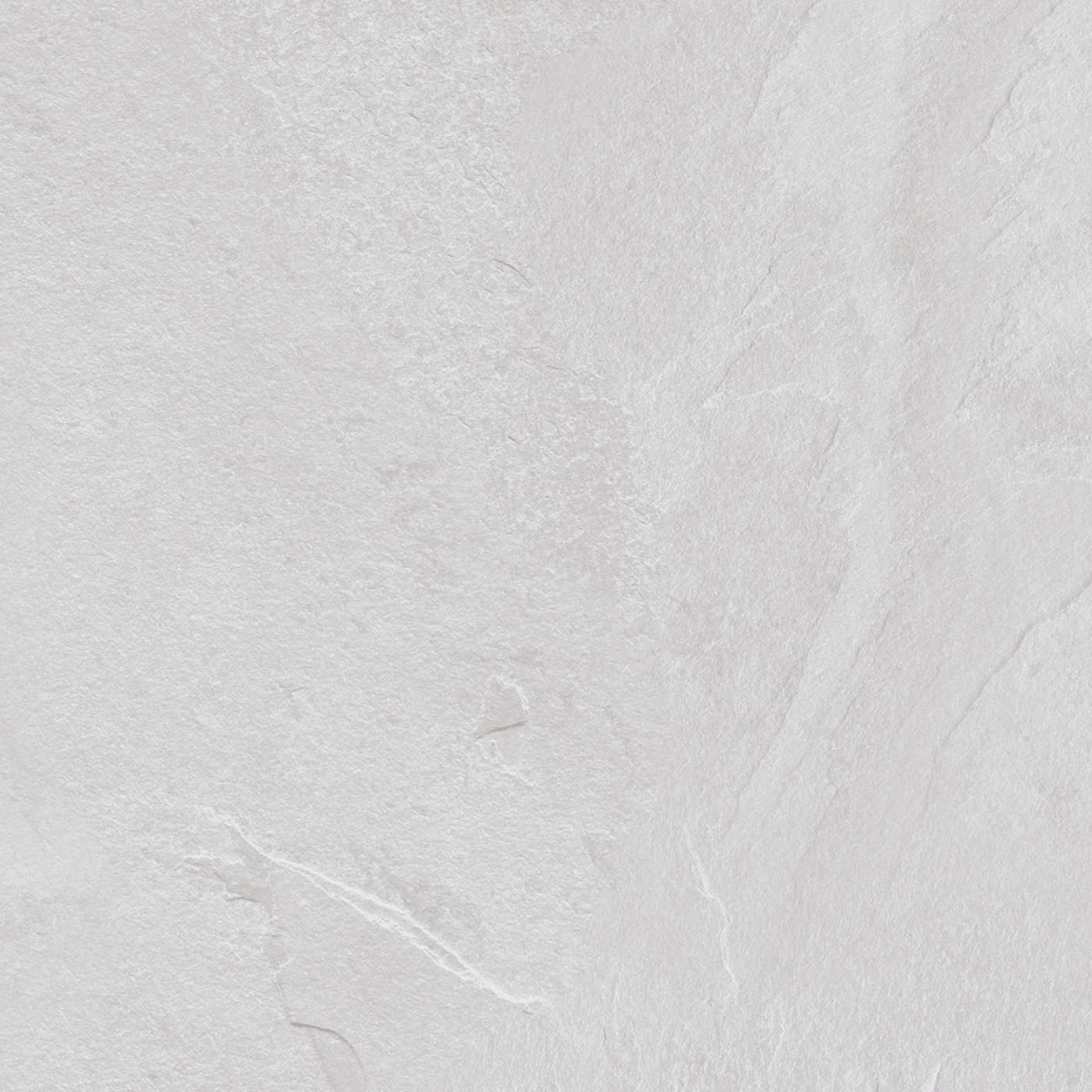 Image of A close-up of a light gray stone or tile surface with subtle natural texture and faint veining.