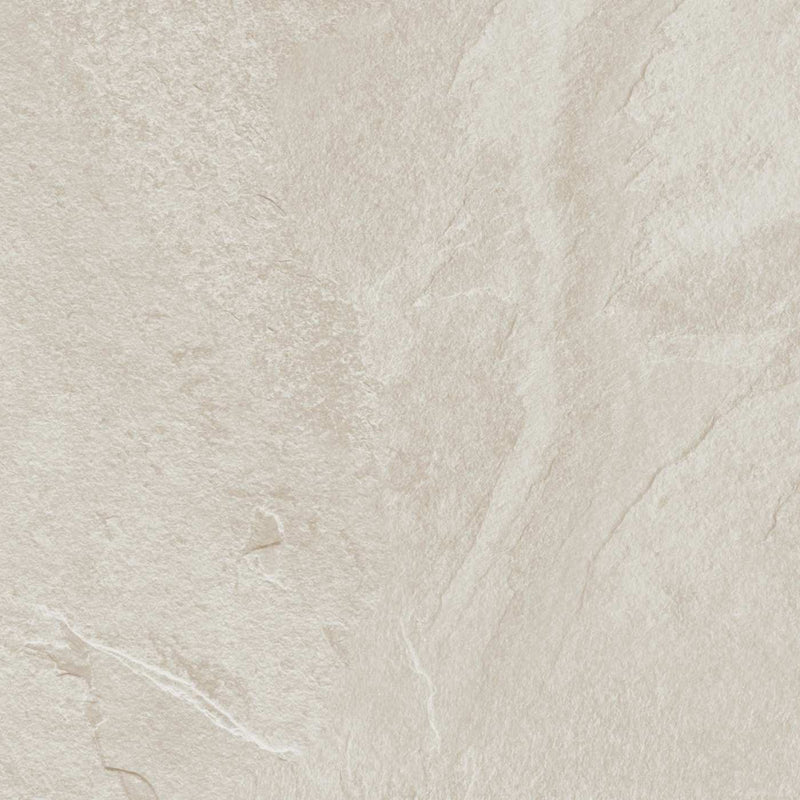Image of A close-up of a light beige stone or tile surface with subtle natural veining and a matte texture.