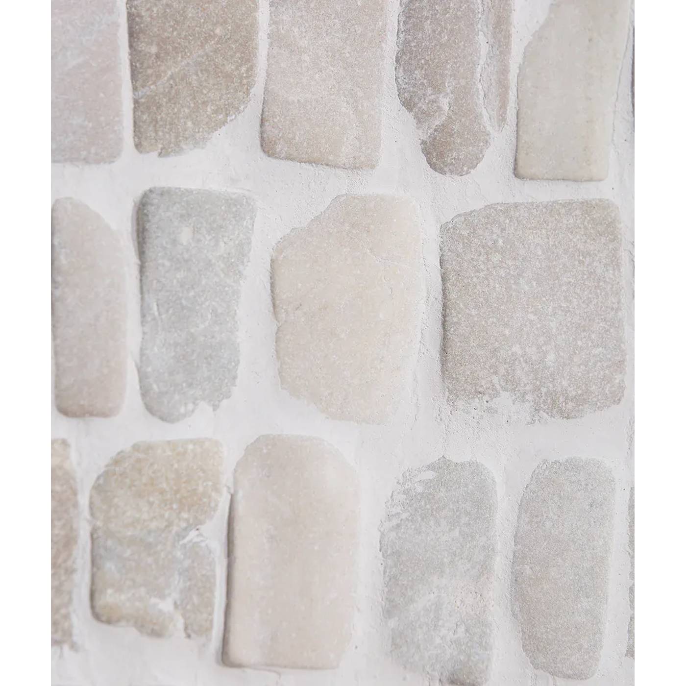 Image of A close-up of a stone tile or wallpaper sample featuring irregular rectangular stone shapes in soft neutral tones of beige, cream, light gray, and off-white.