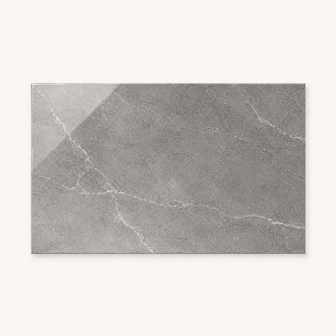Image of A rectangular gray marble-look tile with white veining, displayed against a solid off-white background.