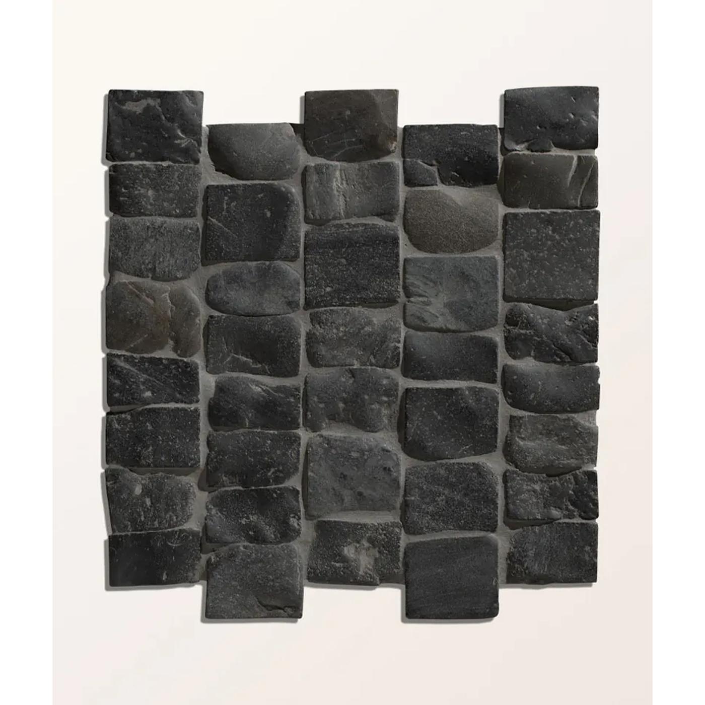 Image of A square sample of dark charcoal stone mosaic tiles arranged in a staggered brick pattern against a plain off-white background.