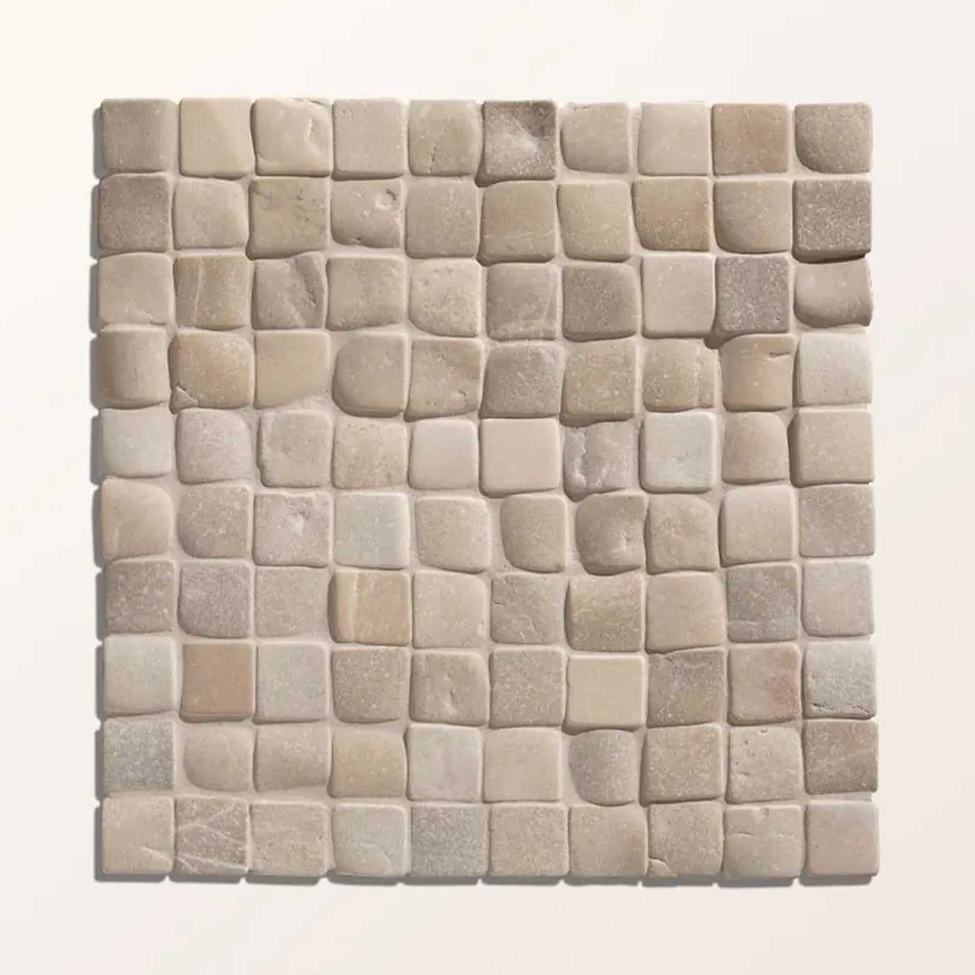 Image of A square mosaic tile sample made of small irregular stone-like pieces in warm light beige, cream, and taupe tones, shown against a plain light background.