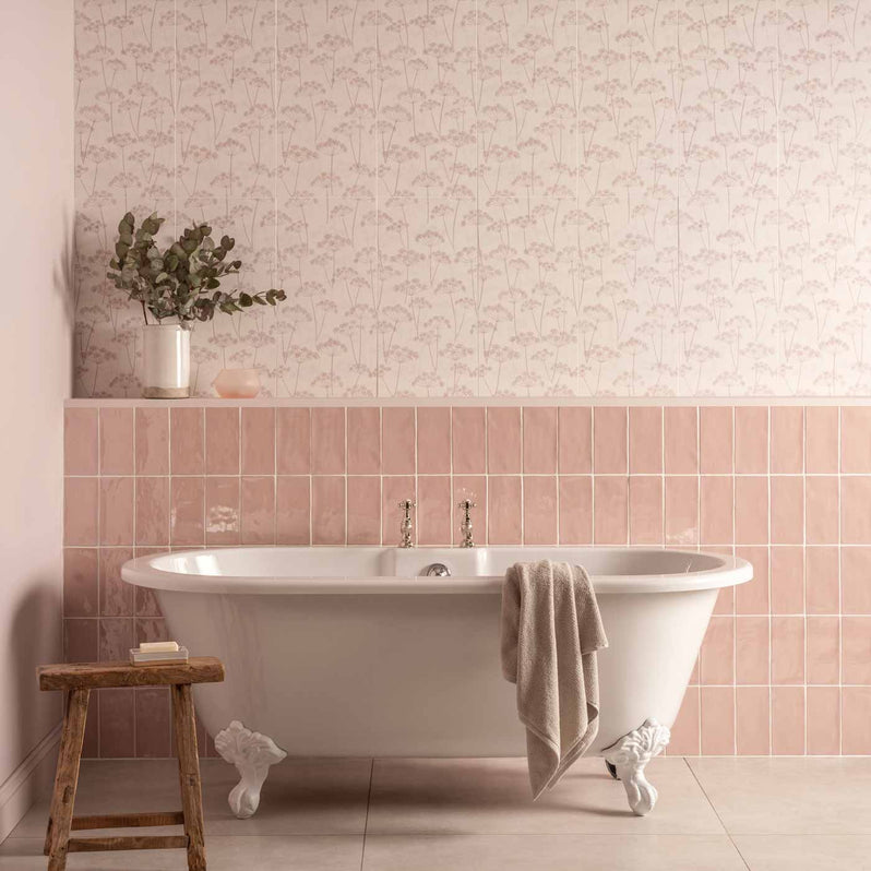 Meadow Hedgerow pattern tiles and pink brick tiles behind a free standing bath
