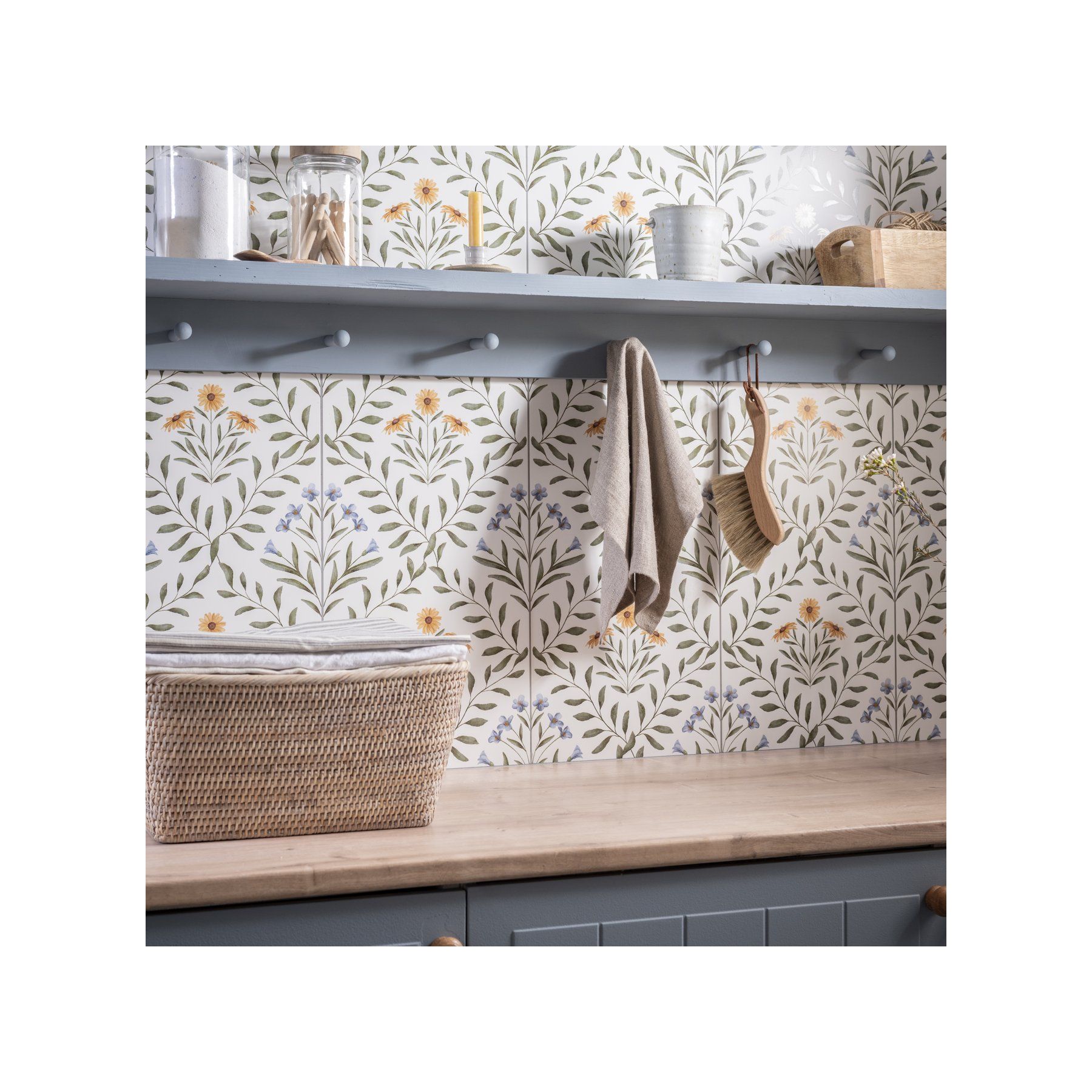 Image of Wall with floral pattern, hooks, and a basket in a kitchen setting
