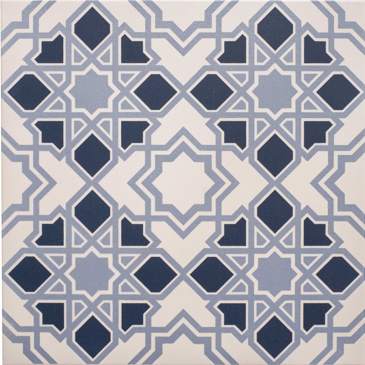 Image of Square tile featuring a geometric star and diamond pattern in light and dark blue on a chalk‑coloured background.”