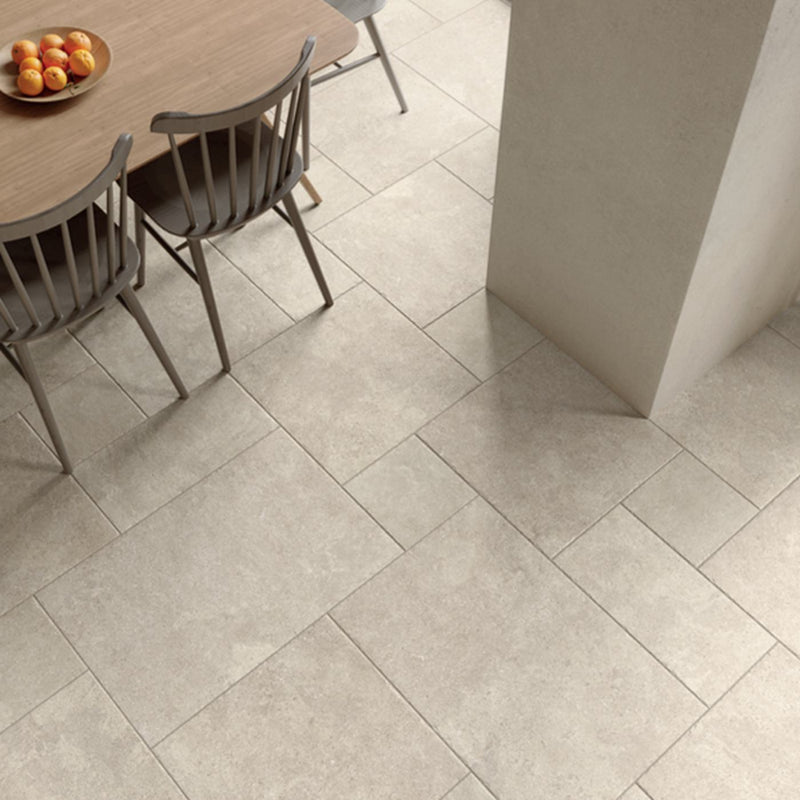 Image of White rectangular floor tiles in a modern dining room setting, shown with a wooden dining table and chairs.