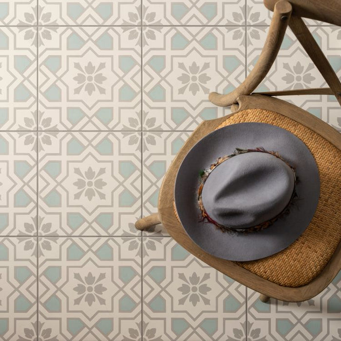 Woven basket with a gray lid on a patterned tile floor