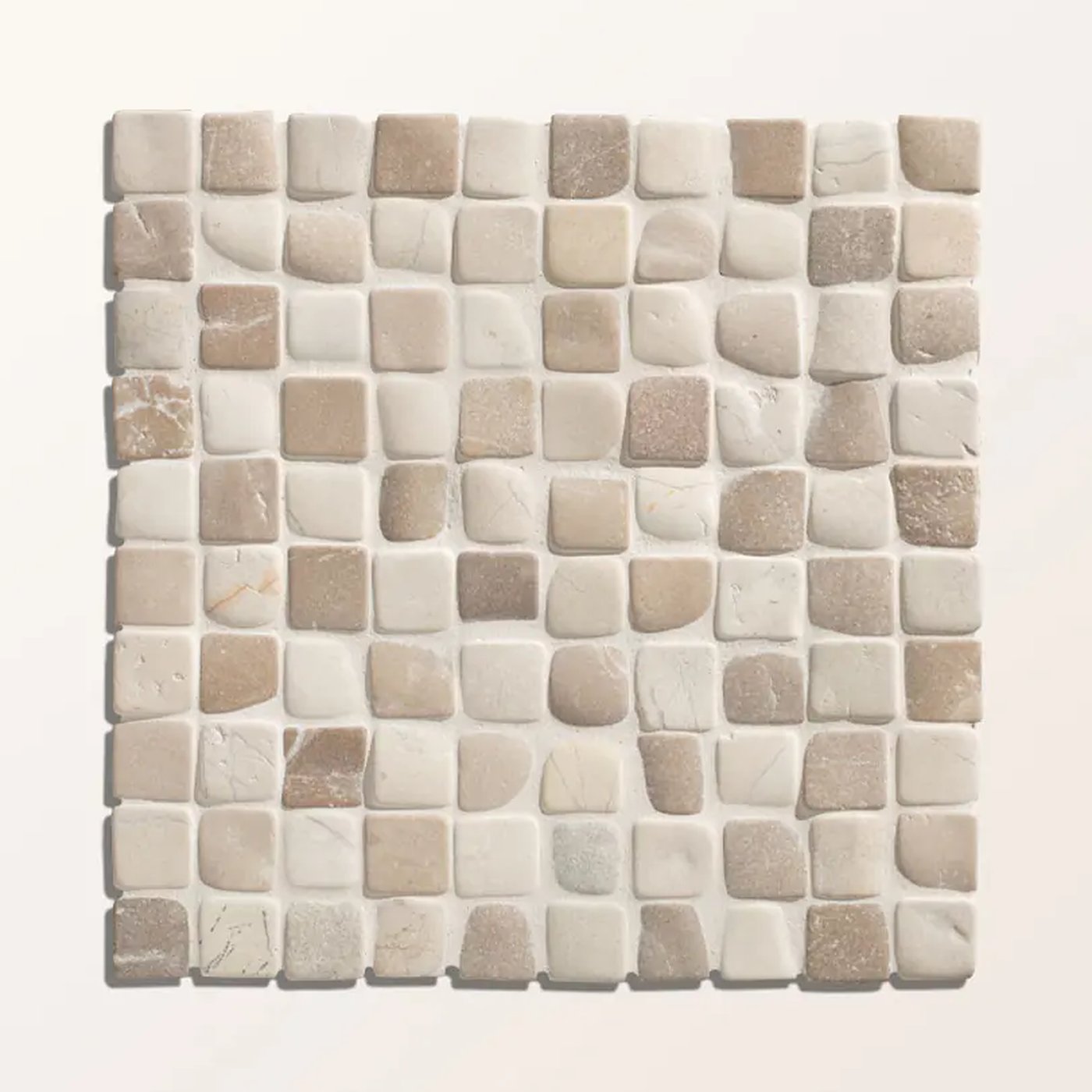 Image of A square mosaic tile sheet featuring small irregular stone-like pieces in warm off-white, beige, and light taupe tones, arranged in a grid with a light gray grout or border.