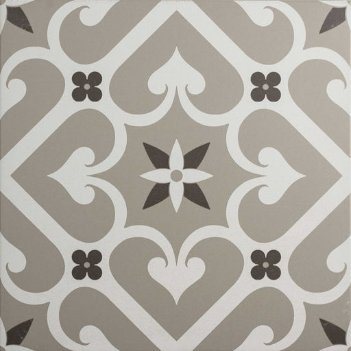 Square tile with a grey and white trellis pattern featuring a central floral motif and small dark grey accents.