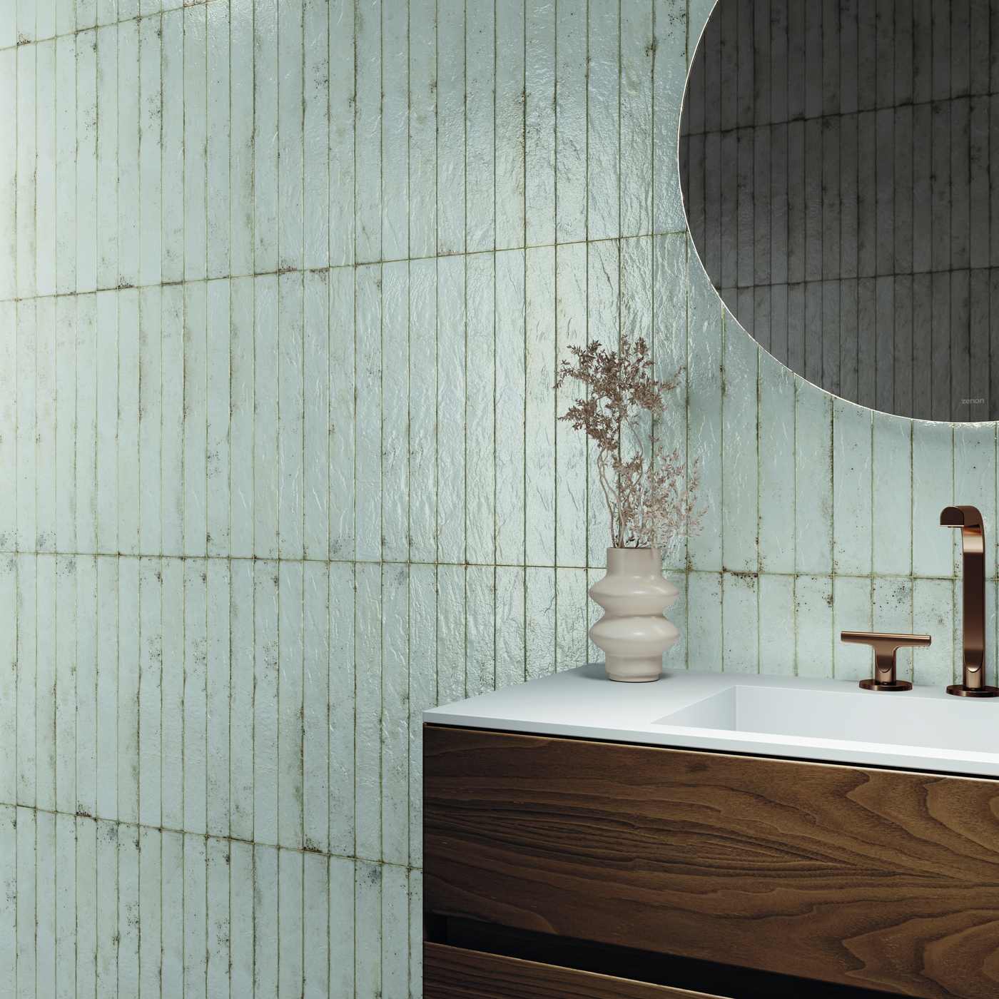 Image of A modern bathroom corner featuring textured, vertically-stacked distressed white tiles on the wall, a white countertop with a dark wood vanity, a white sink basin, a bronze faucet, and a round mirror.