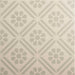 Patterned tile with geometric design on a beige background