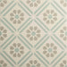 Patterned tile with geometric design on a beige background