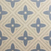 Patterned tile with blue and beige design