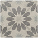 Geometric patterned rug with star design on a beige background
