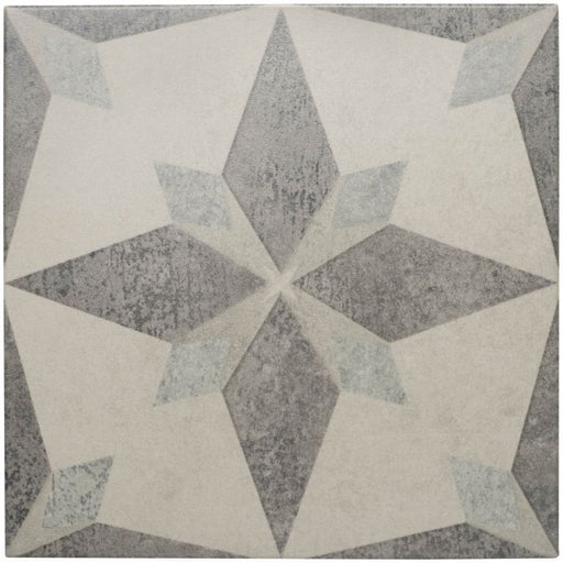 Geometric patterned tile with star design on a gray background