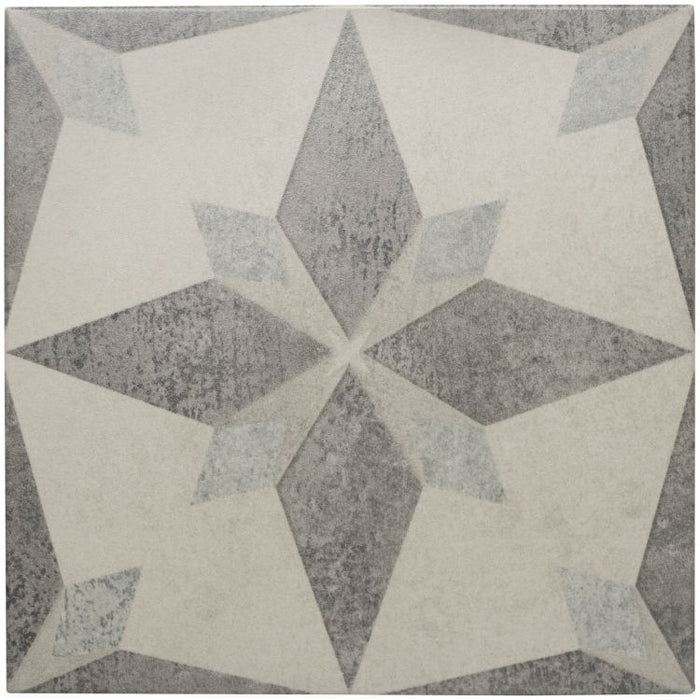 Geometric patterned tile with star design on a gray background