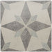 Geometric patterned tile with star design on a gray background