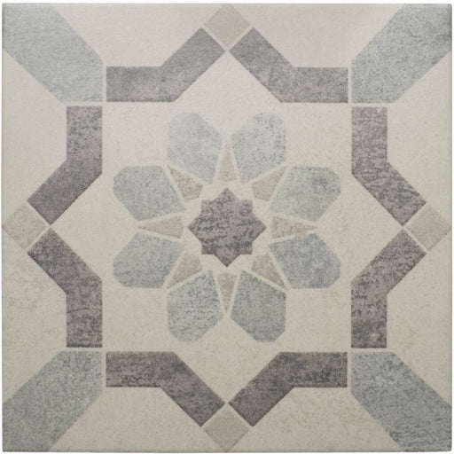 Square tile featuring a geometric star‑inspired pattern in soft grey and muted blue tones