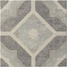 Geometric tile pattern in muted grey and beige tones with a central diamond and star-like motif.