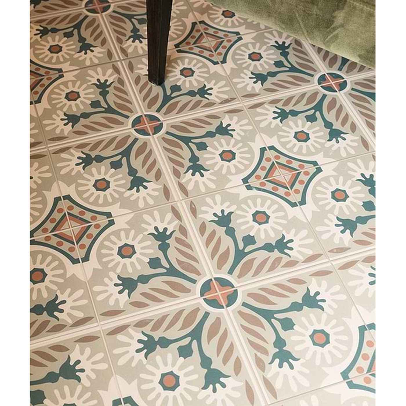 Image of Decorative floor tiles with a geometric pattern on a tiled floor.