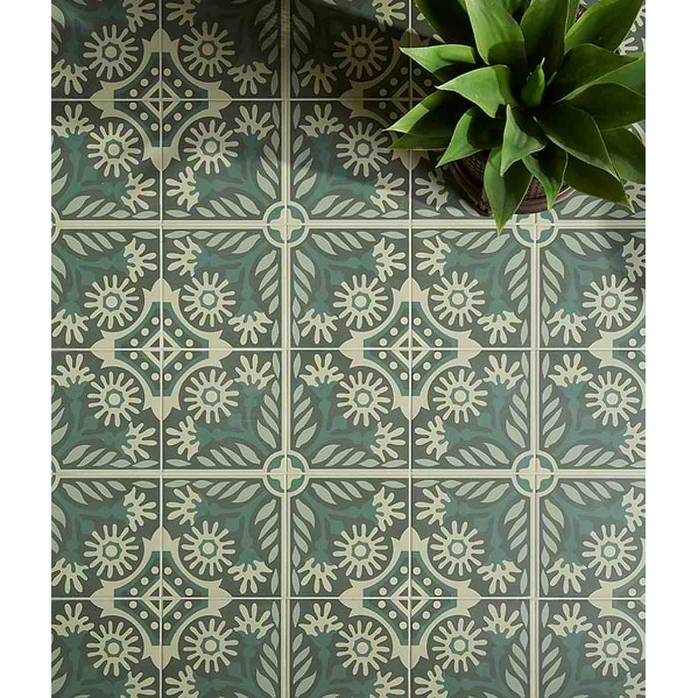 Image of Decorative green and white tiles with a plant on top