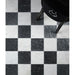 Black chair on a checkered black and white floor