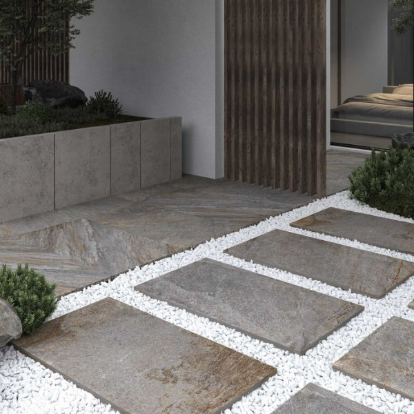 Image of Outdoor patio with stone tiles and white gravel