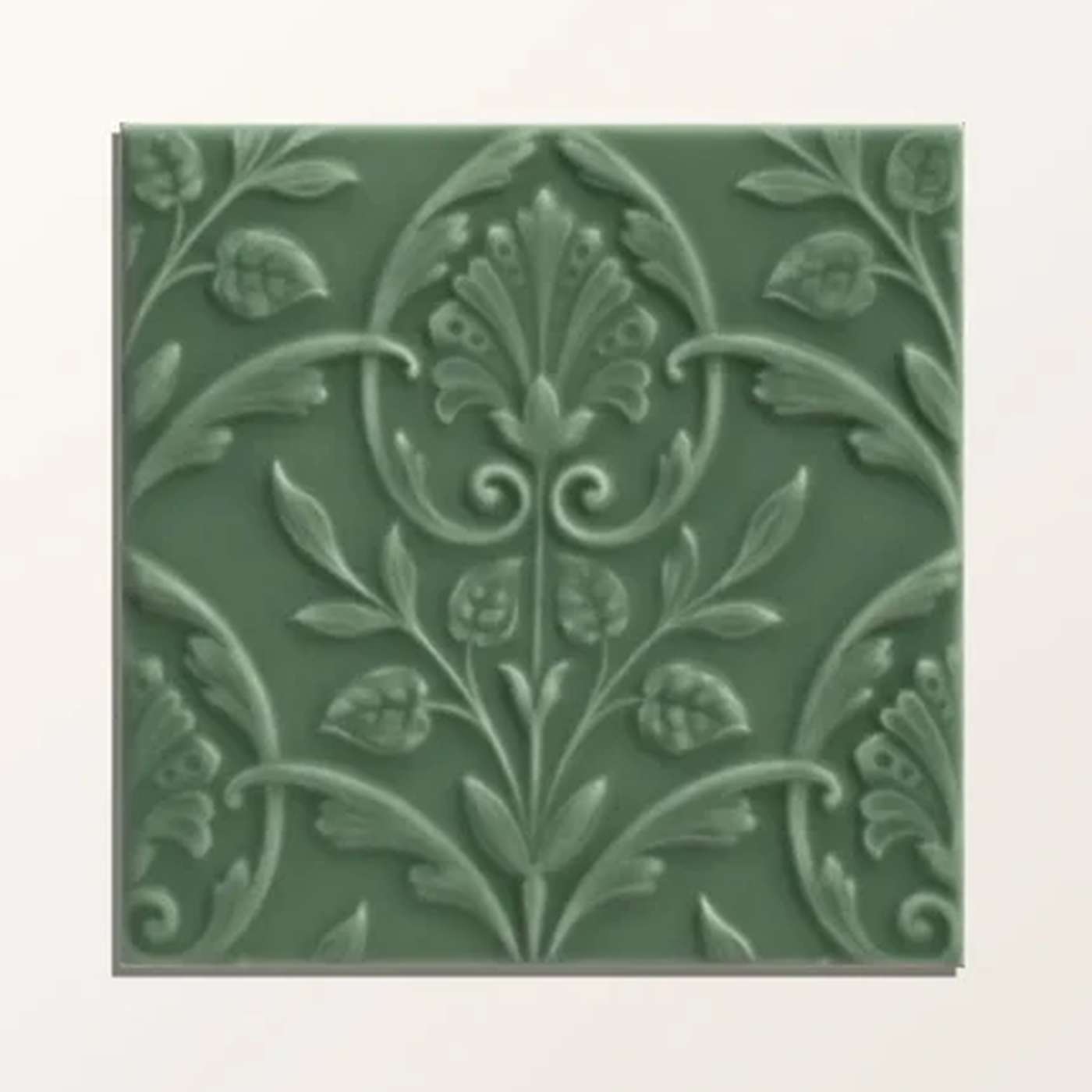 Image of Decorative green tile with floral pattern on a white background