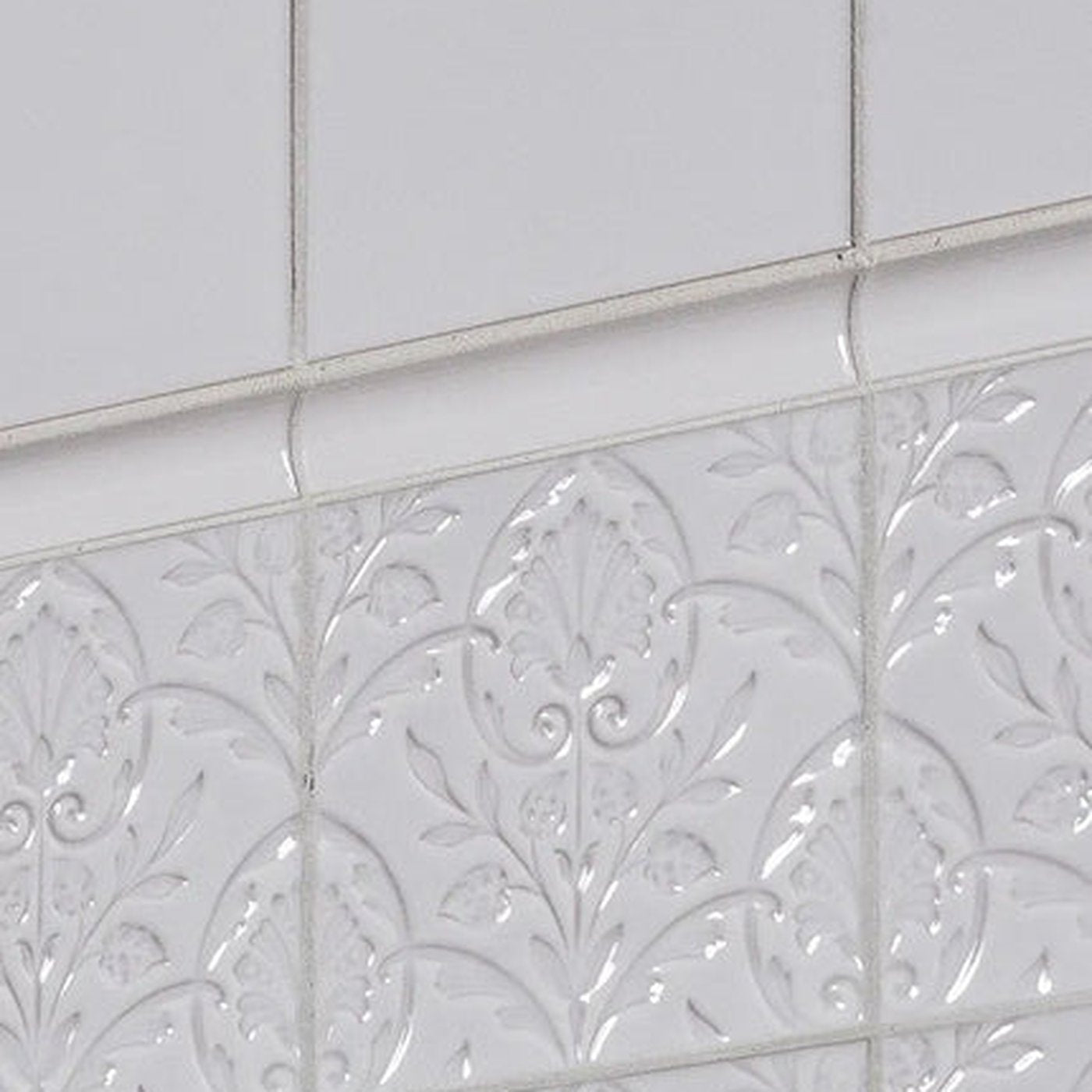 Image of Patterned white tiles with border tile and plain tile