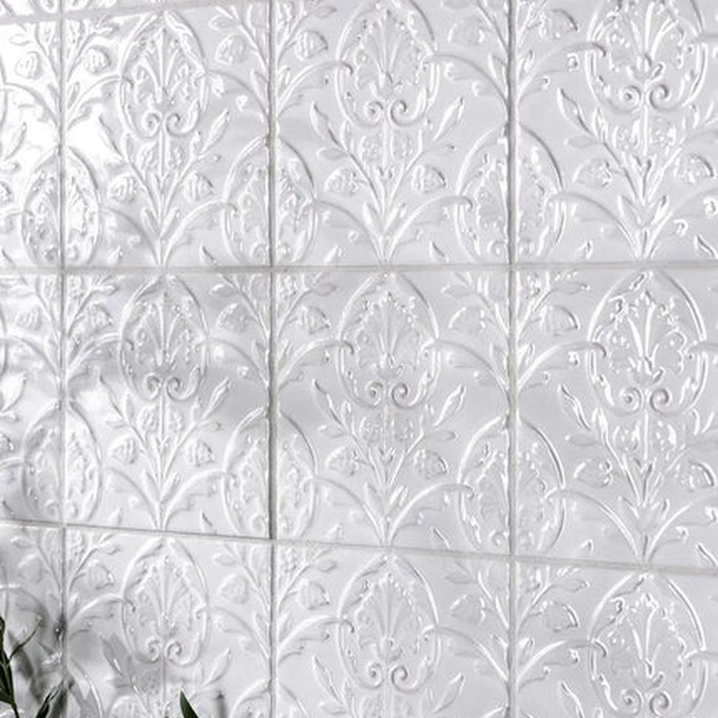 Image of Wall tiled with small square patterned white tiles