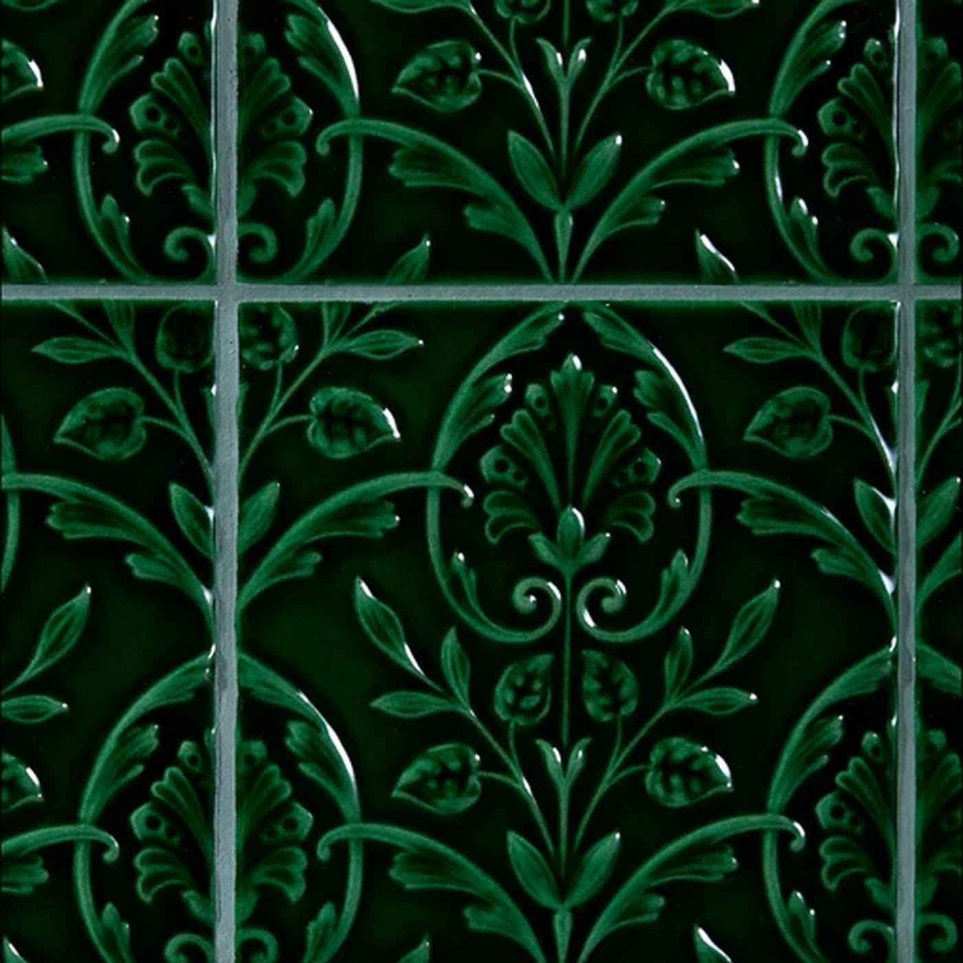 Image of Decorative green tiles with intricate floral patterns on a black background